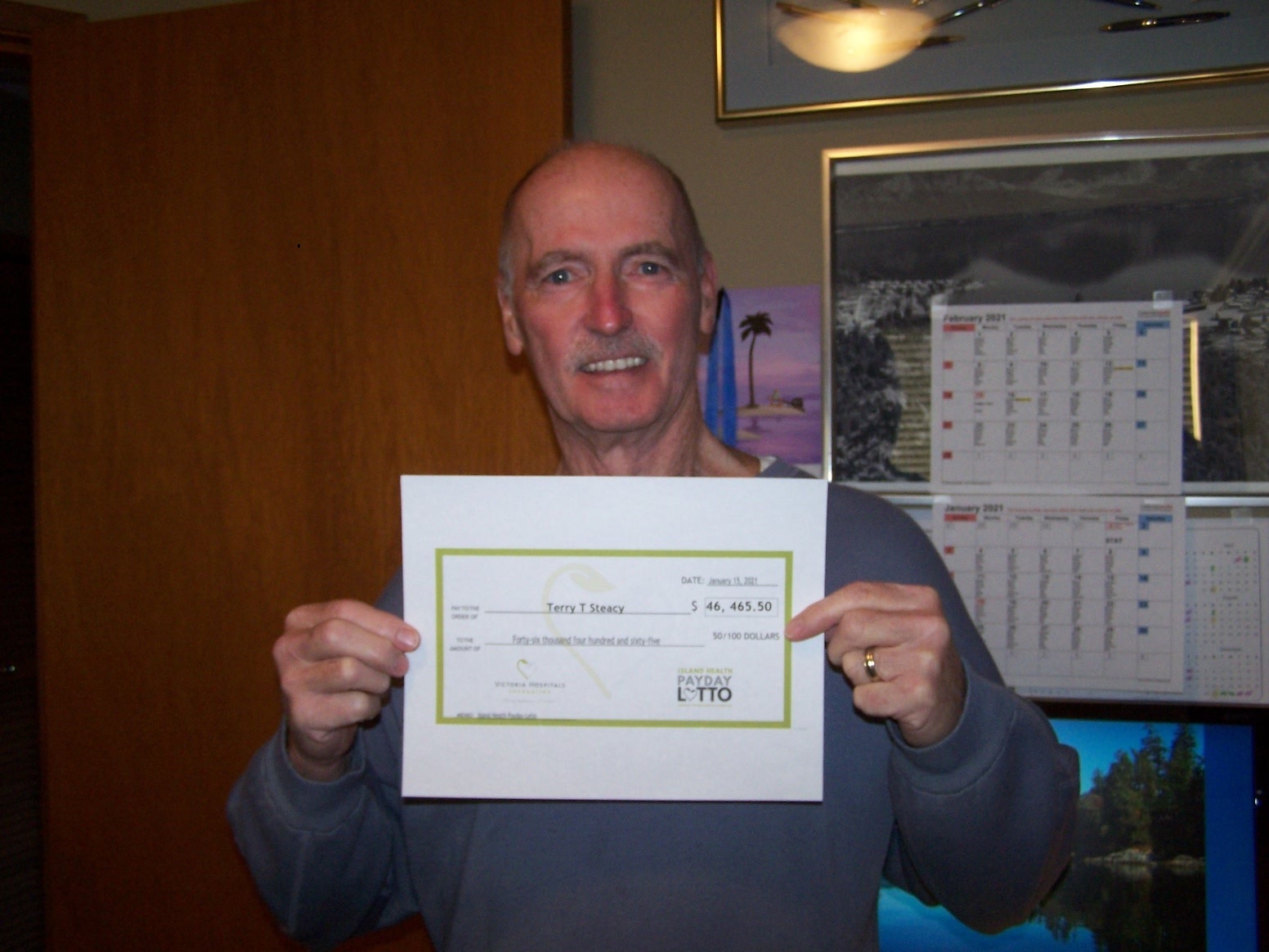 Terry & his payday lotto winnings cheque