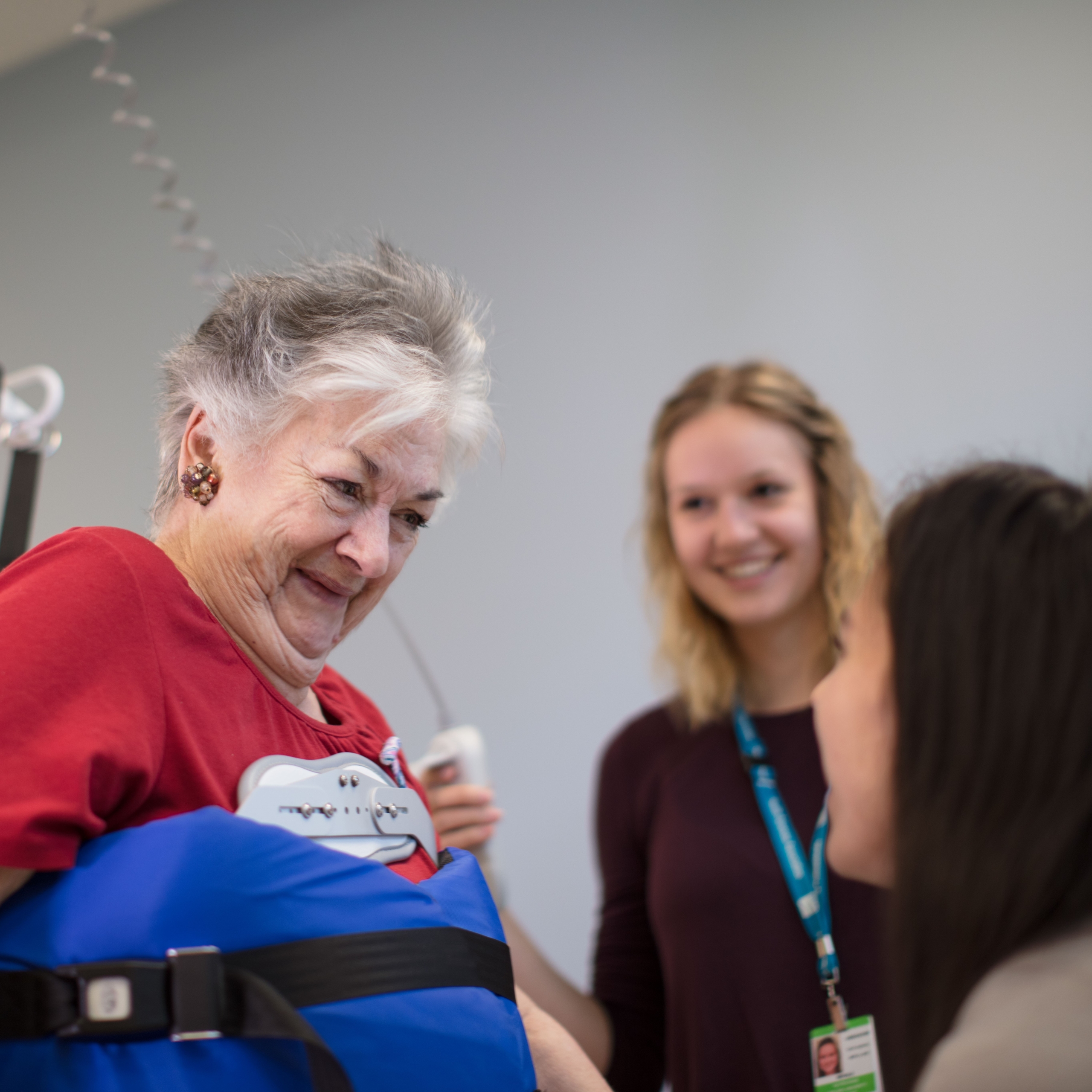 Woman on a rehab rig with her caregivers