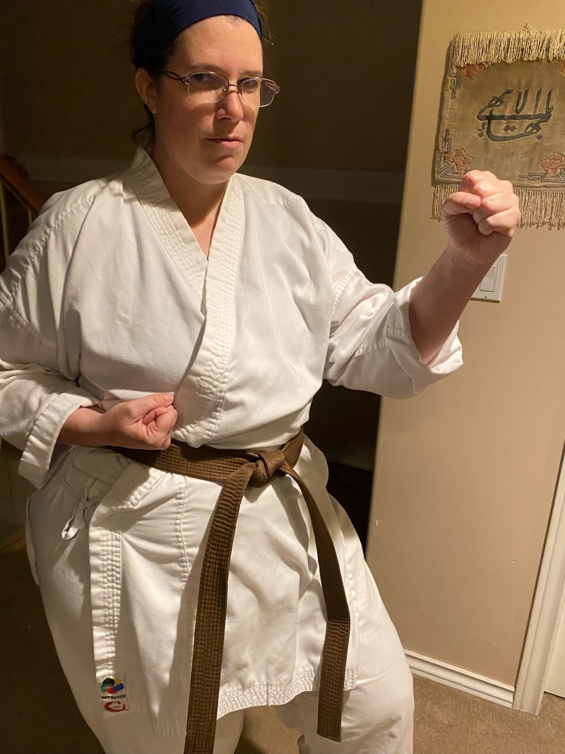 Dr. Hayley Bos in her Karate gi and brown belt