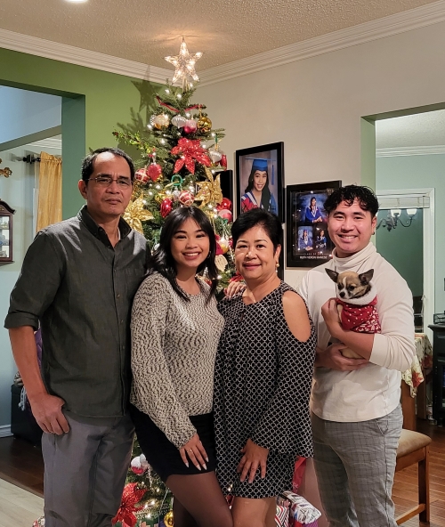 Ruby Manese with her husband Rex, daughter Ruth, & Son Royce in front of their Christmas tree