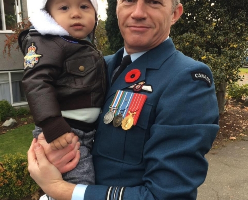 Major Greg Clarke with his son