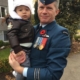 Major Greg Clarke with his son