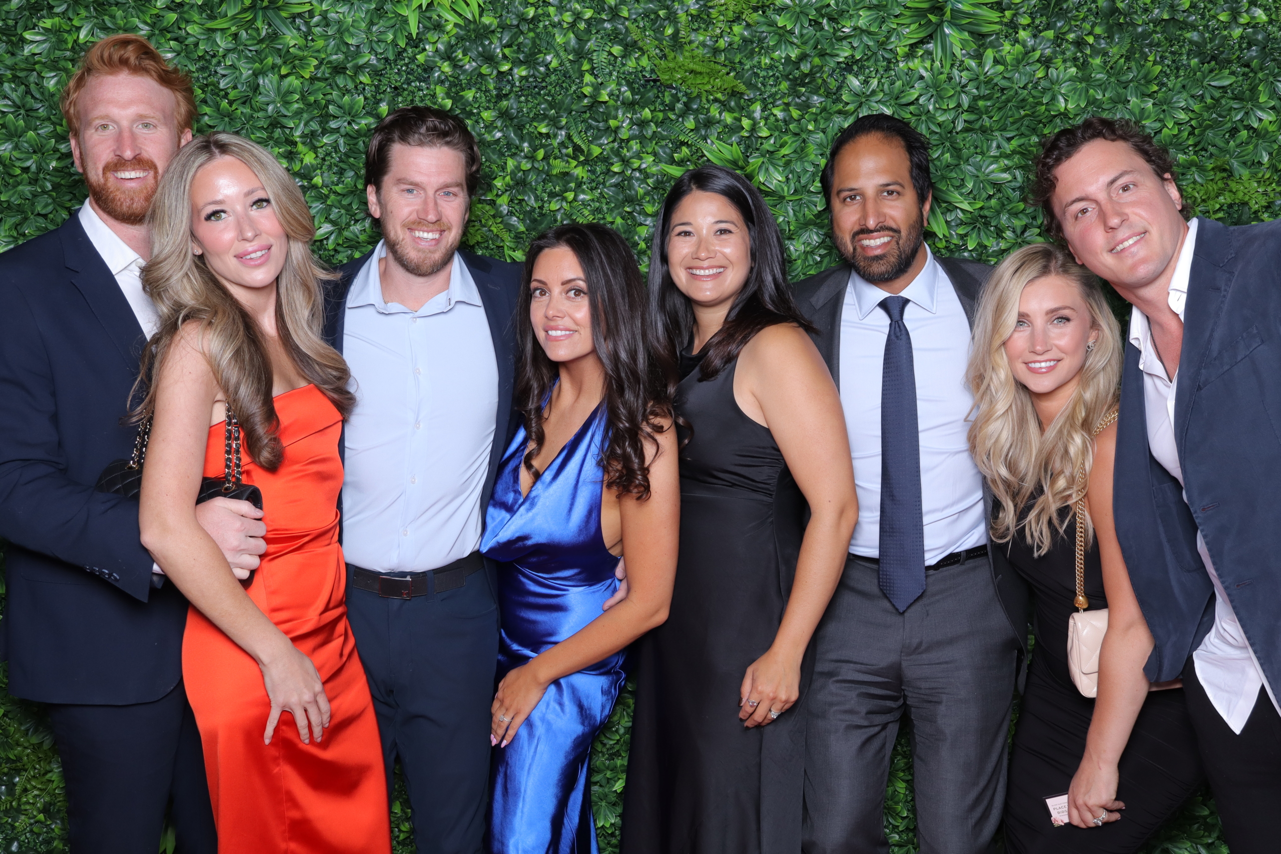 Miracle Gala Guests Including Former NHL Player Tyson Barrie posing at a photo wall