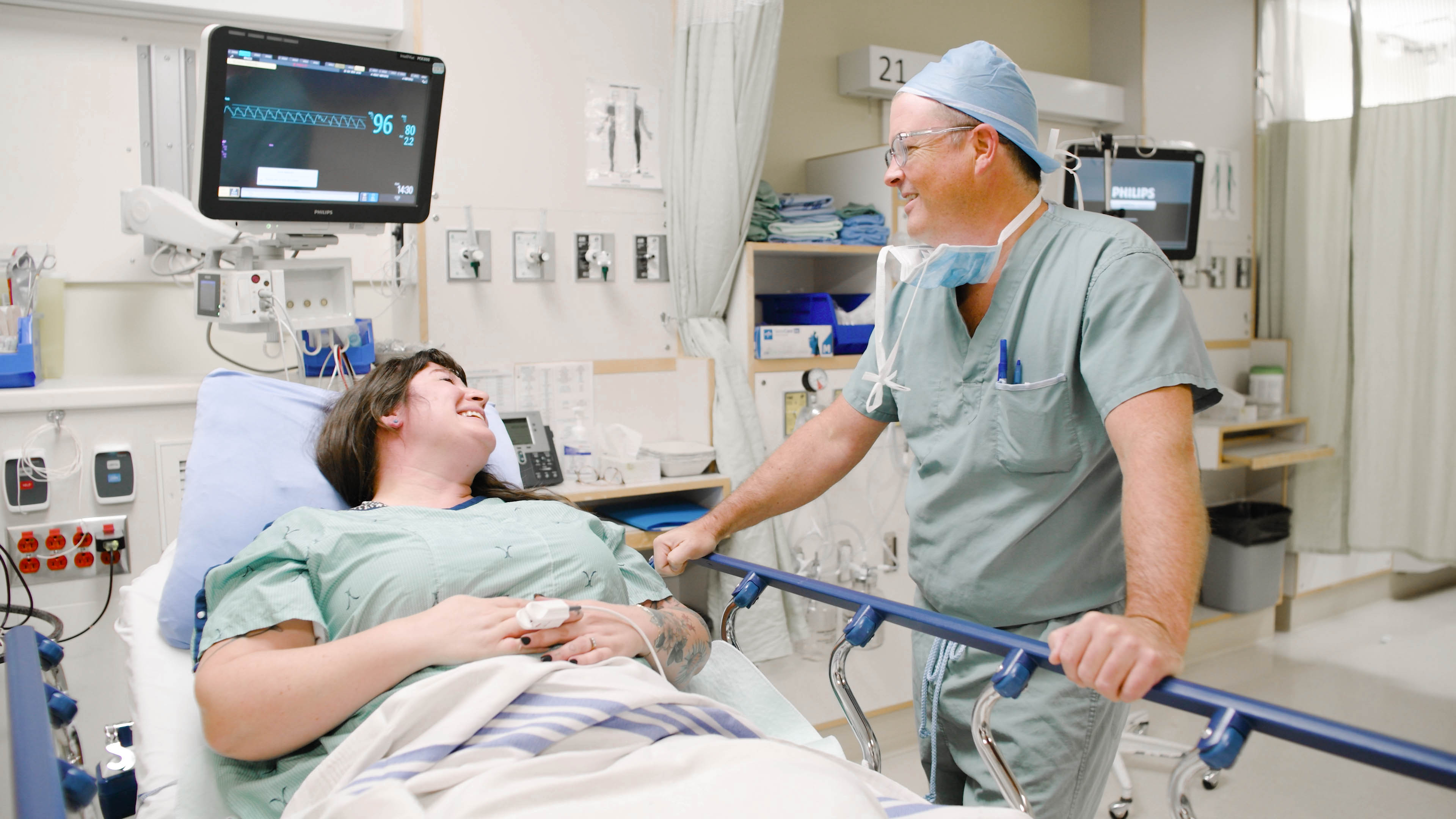 Dr. Jeff McCracken, a Urologist, speaking with a patient at Royal Jubilee Hospital (RJH)