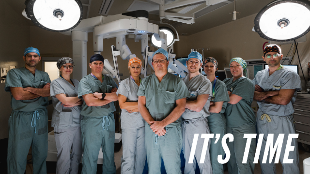 "It's Time" Victoria BC Surgeons standing in front of the da Vinci surgical robotics system at Royal Jubilee Hospital.