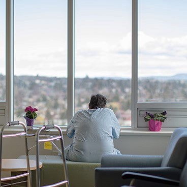 Patient looks out the window at Royal Jubilee Hospital (RJH)