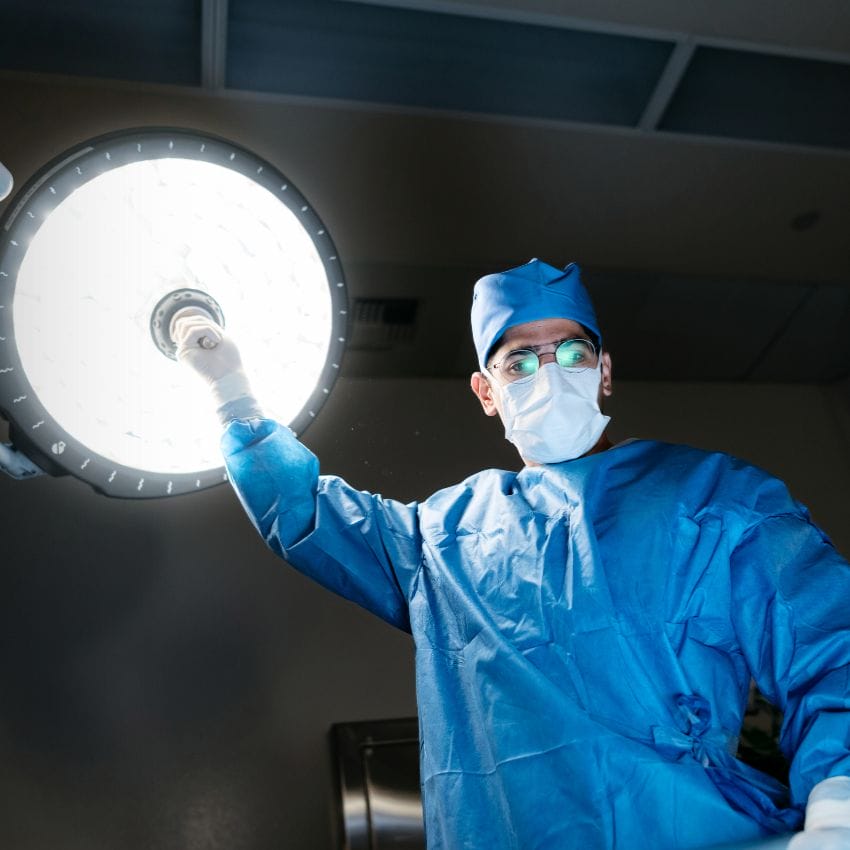Dr. Sepehr Khorasani, Colorectal surgeon at Royal Jubilee & Victoria General hospitals adjusting an operating room light