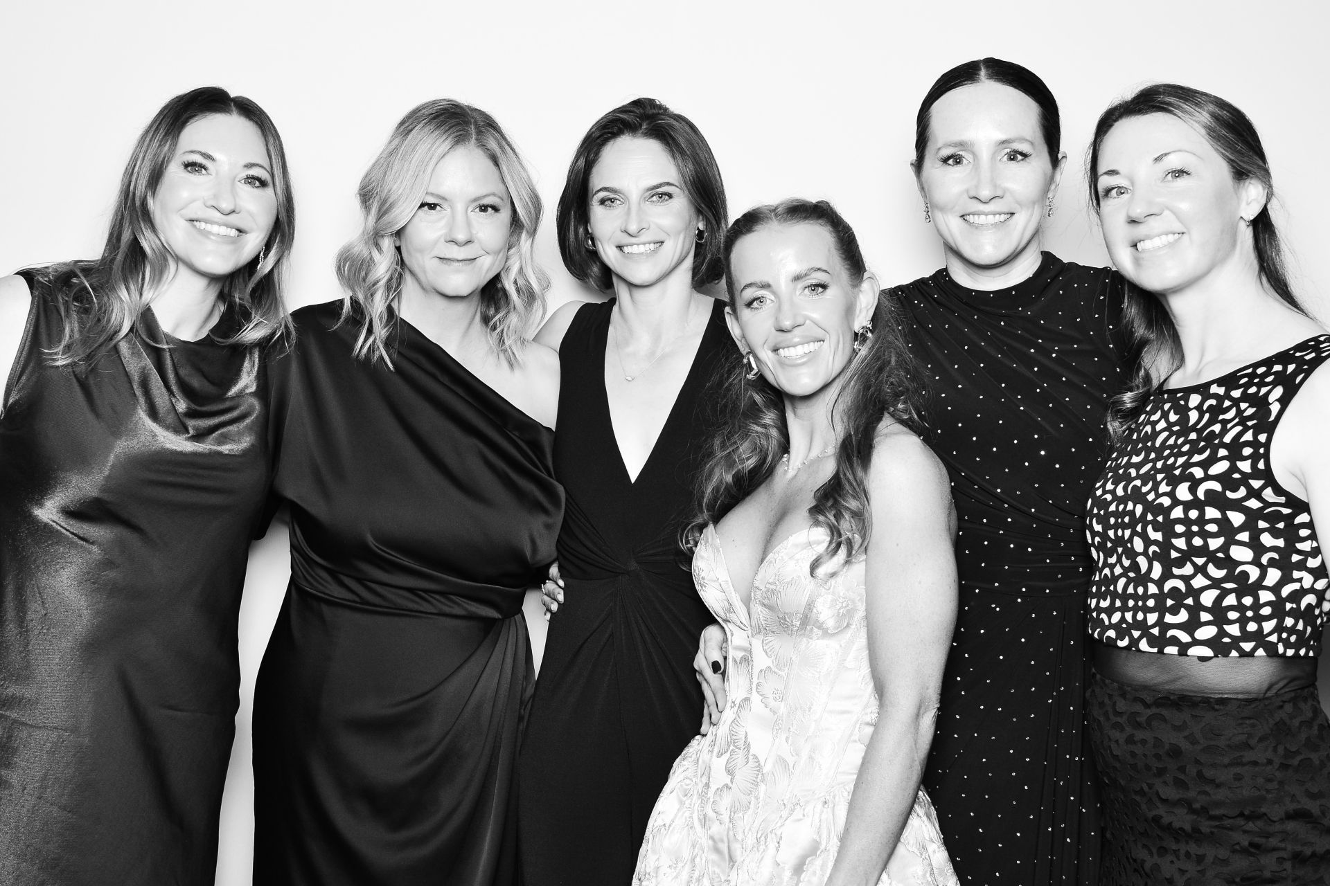 0042 Guests, including Visions Committee member Sophia Chadwick, posing in a photobooth at Visions 2025