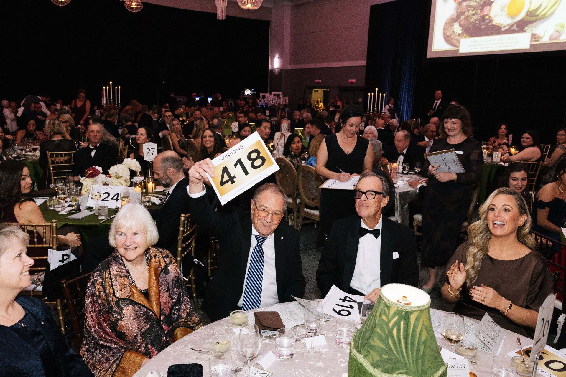RCP-VISIONS-2025-418 (1) Guests during the live auction at the Visions Gala at the Fairmont Empress Hotel