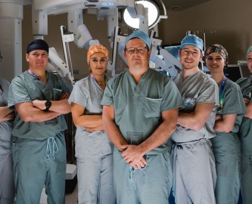 Surgeons Dr. Sohrab Khorasani, Dr. Cailan Macpherson, Dr. Mona Mazgani, Dr. Jeff McCracken, Dr. Greg Hosier, Dr. Sephr Khorasani, and several surgical nurses with the donor funded da Vinci surgical robot at Royal Jubilee Hospital