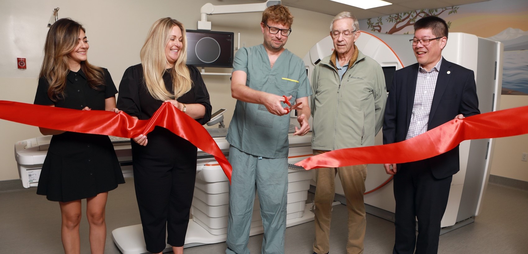 Donors Amy Ratcliff & Craig Mearns, Foundation representatives Avery Brohman and Ian Wong, and radiologist Dr. Alan Andrew cut the ribbon to unveil a brand new CT scanner at Victoria General Hospital (VGH)