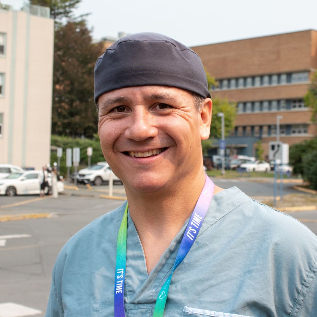 Dr. Cailan MacPherson, surgical oncologist, in front of Royal Jubilee Hospital
