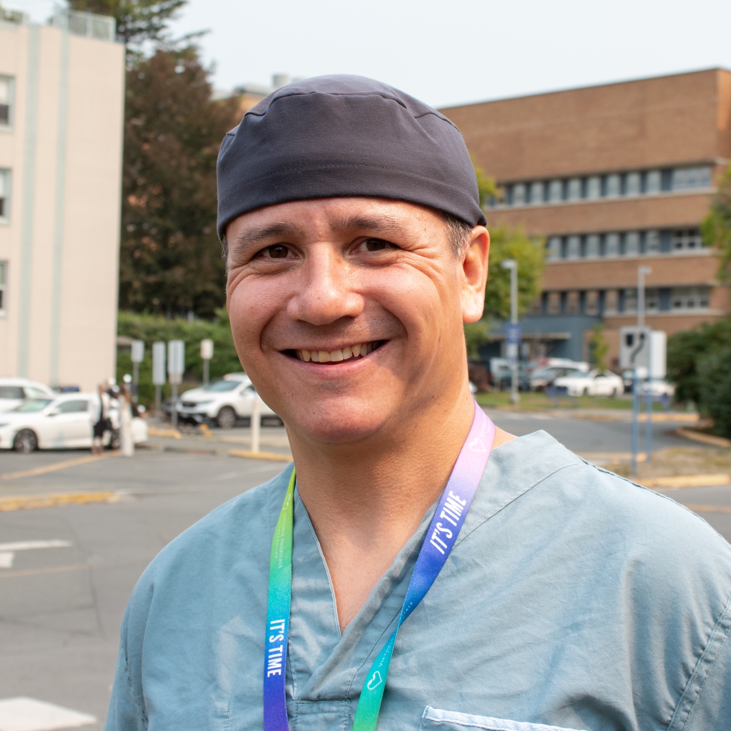 Dr. Cailan MacPherson, surgical oncologist, in front of Royal Jubilee Hospital