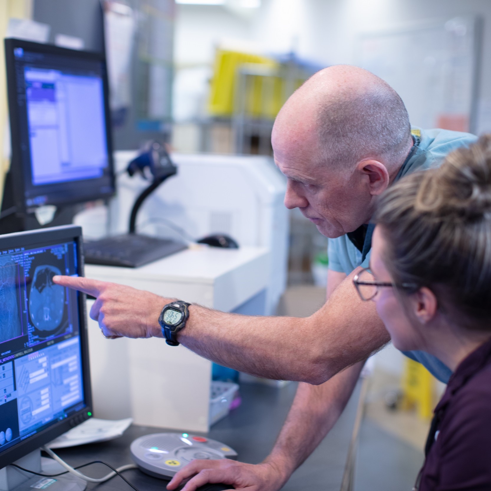 Dr. Silver reviews medical imaging scans at Victoria General Hospital