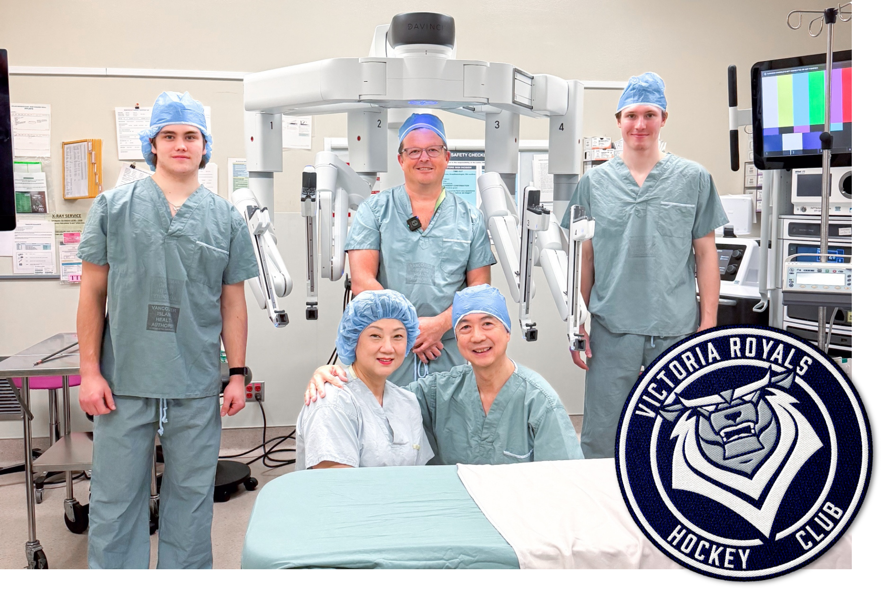 Victoria Royals Hockey Players Miles Cooper and Reggie Newman, Urologist Dr. Jeff McCracken, and VHF donors Fancy & David with the Da Vinci Surgical Robot