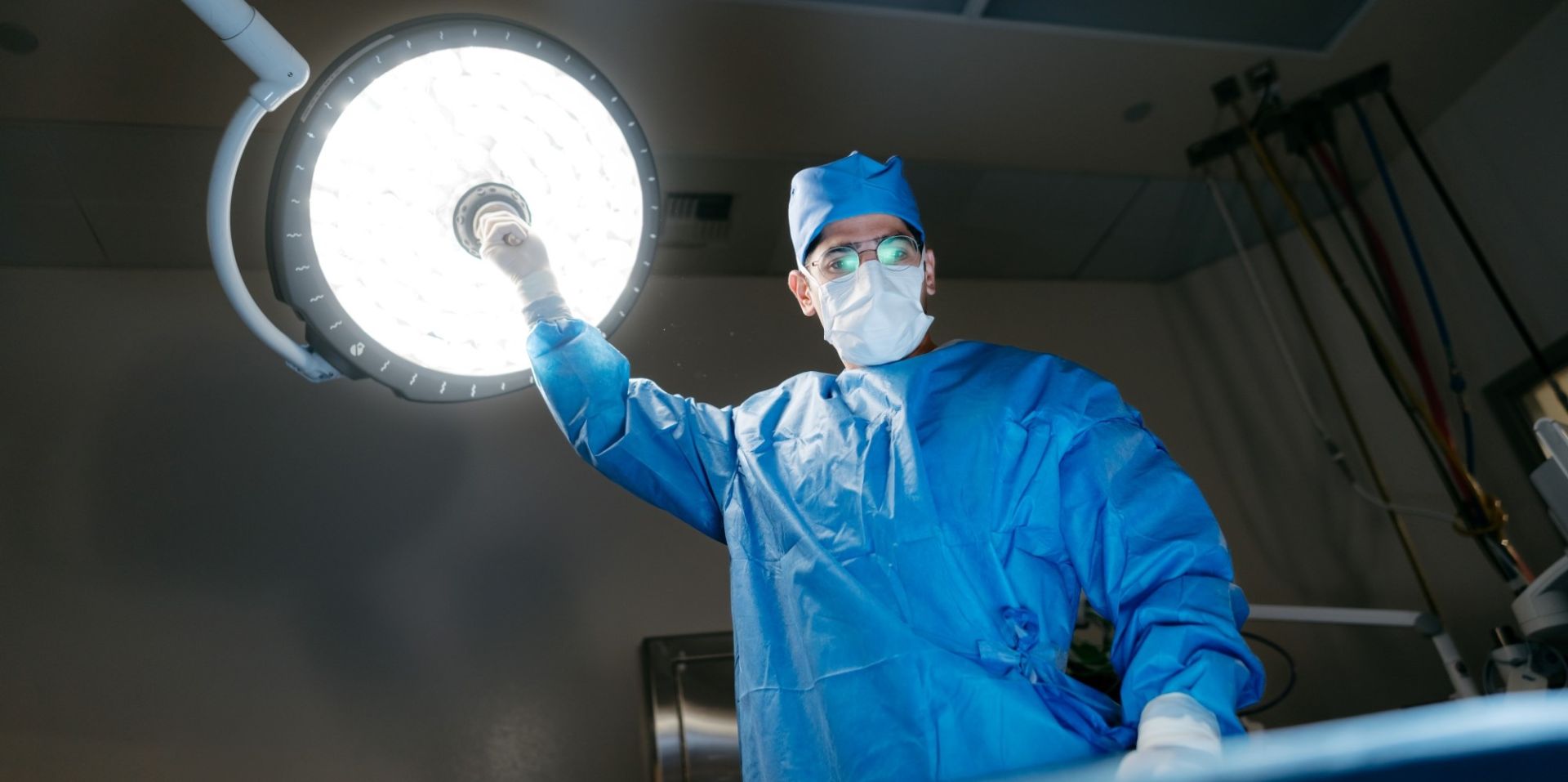 Dr. Sepehr Khorasani, Colorectal Surgeon at Victoria General Hospital holding a Operating Room light