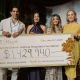 Physician Speaker Dr. Sepehr Khorasani (left), Patient Speaker Shaveeta Jnagal, Gala Chair Amy Ratcliff, and Foundation CEO Avery Brohman hold the cheque for the evening's total_ $1,429,940, at Royal Roads University