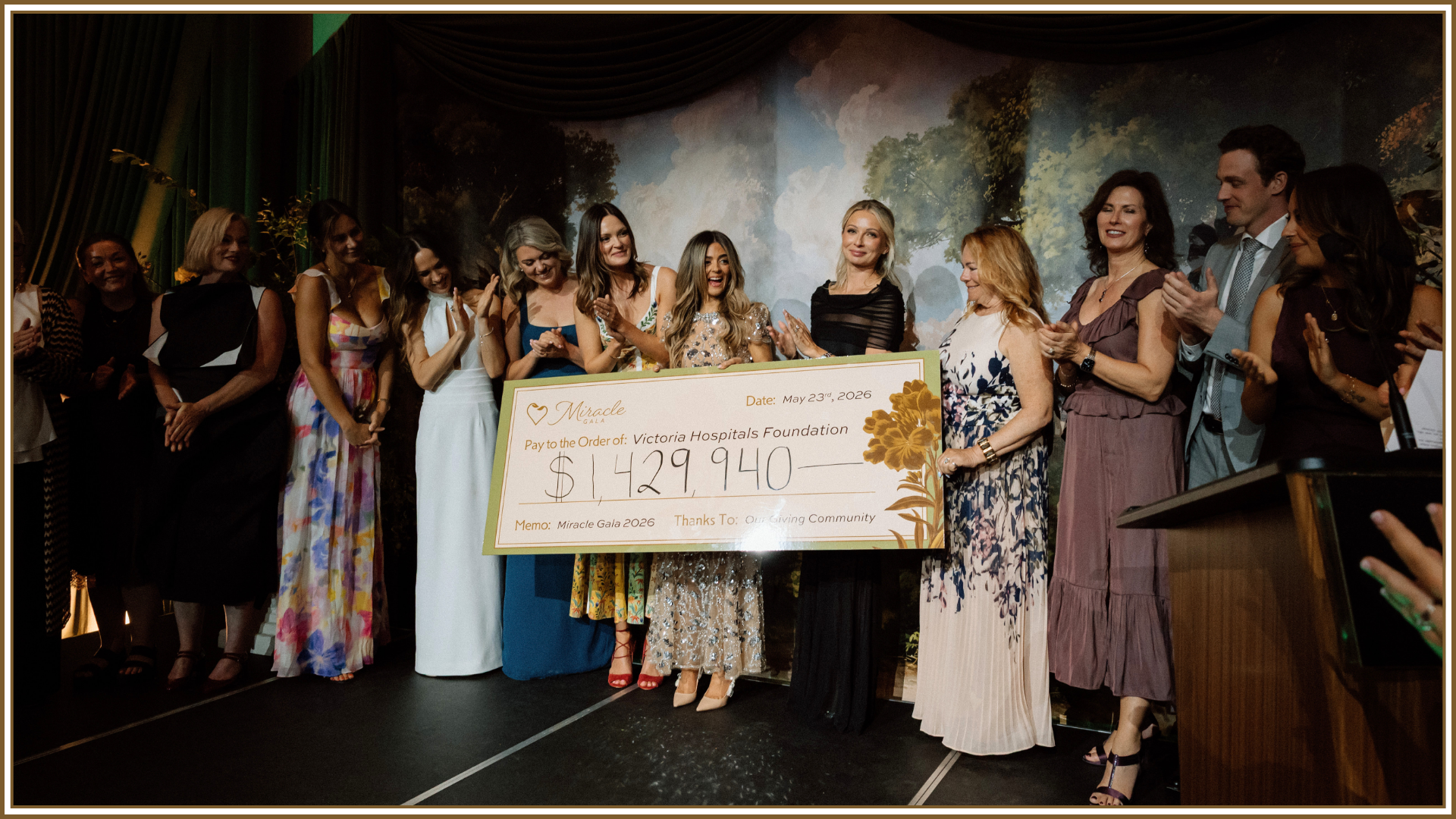 Miracle Gala Committee members hold up the final total cheque for $1.43 million at the 2026 Miracle Gala held at Royal Roads University