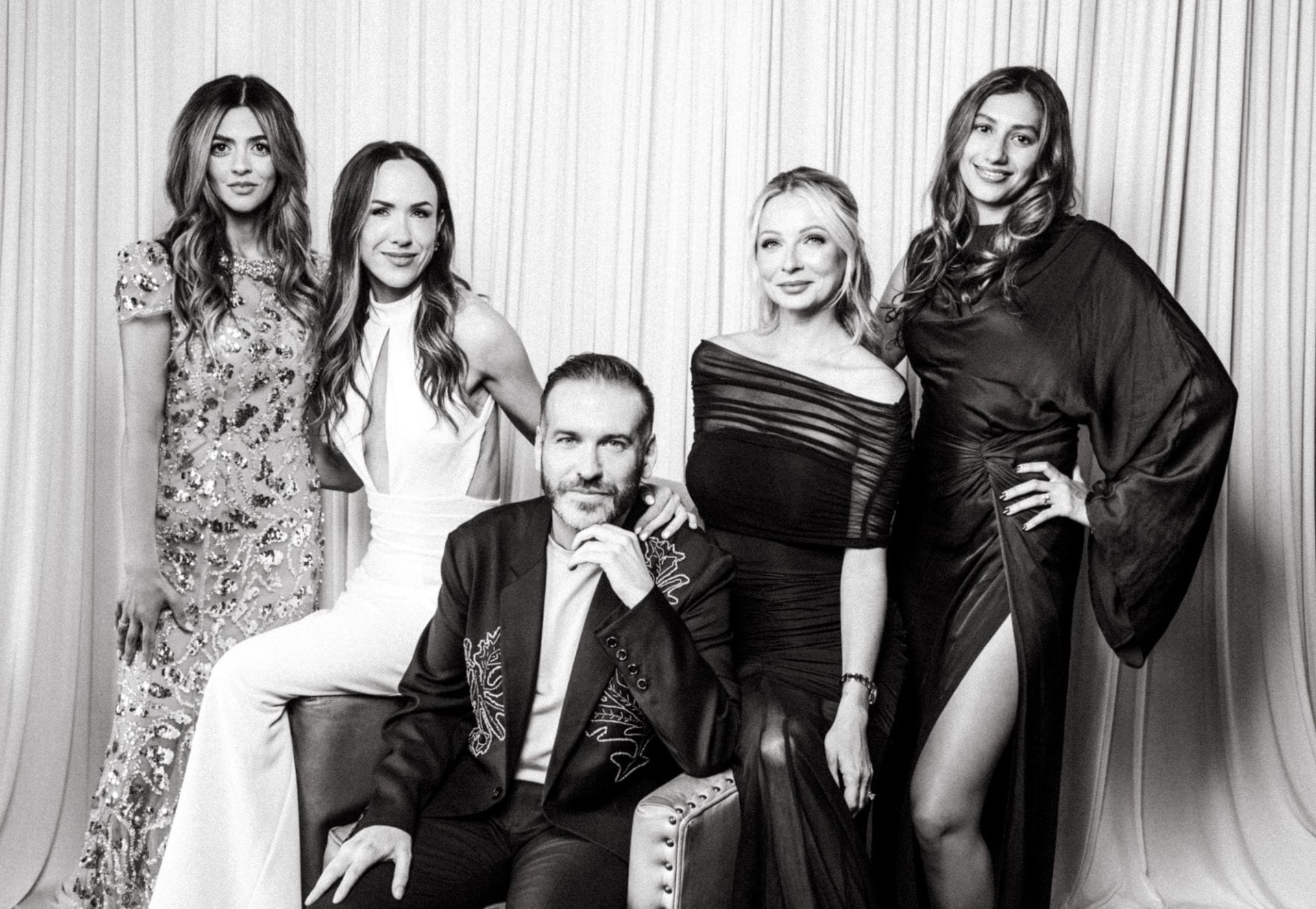 Miracle Gala Chair Amy Ratcliff, Gala Committee members Ola Zailo and Jessica Kliman, Engel & Volkers Team member Mark Deacon, and and another guest pose for a photobooth portrait.