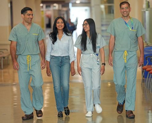 From left, Dr. Sepehr Khorasani, Shaveeta Jnagal, sister Raveena Jnagal and Dr. Mohammadali (Sohrab) Khorasani in a hallway at Royal Jubilee Hospital.