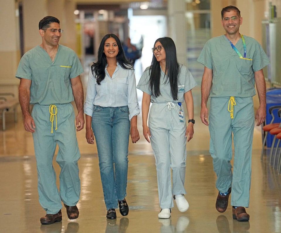 web1_vka-surgical--0179001790 From left, Dr. Sepehr Khorasani, Shaveeta Jnagal, sister Raveena Jnagal and Dr. Mohammadali (Sohrab) Khorasani in a hallway at Royal Jubilee Hospital.